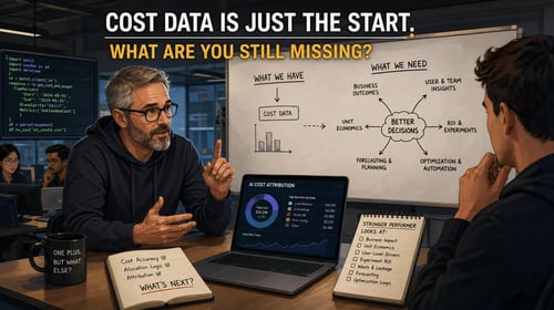 Two engineers discuss AI cost data and decision-making strategies with notes and graphs on a whiteboard and laptop.